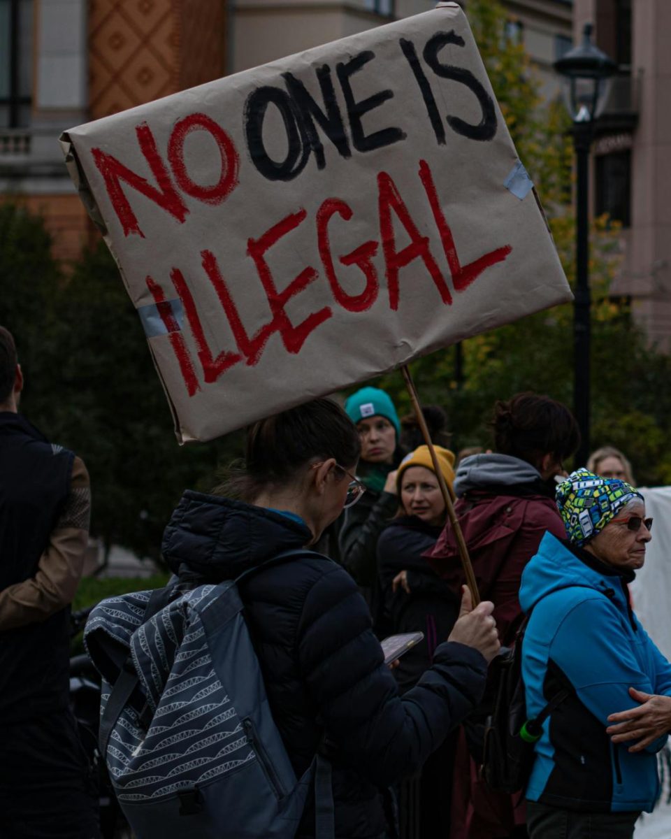 Protesters gather to voice their concerns over local immigration enforcement.