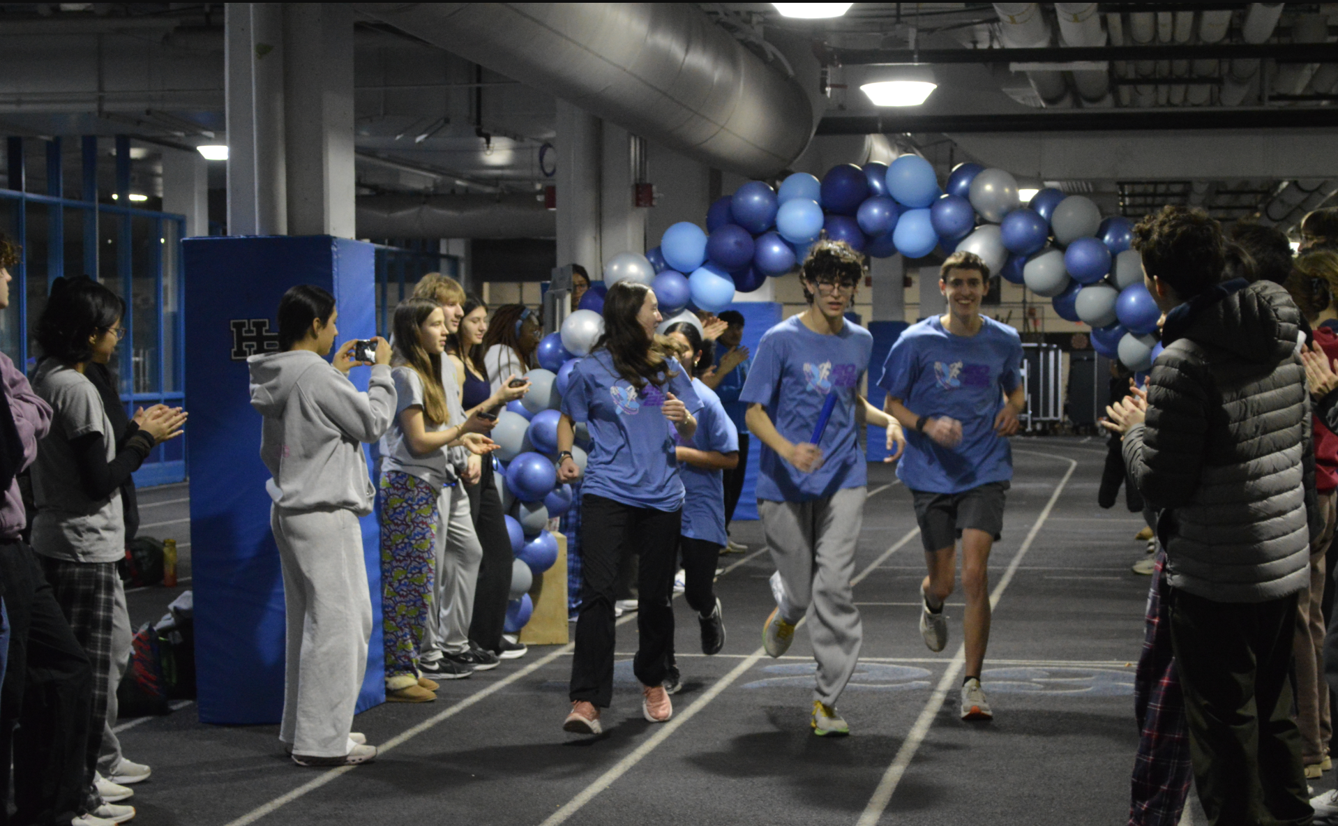 Final moments of the 2026 24 Hour Run, featuring coordinators Daniel Doyle, Lakshmi Harris, Makena Duggan, and Gabi Goldstein.