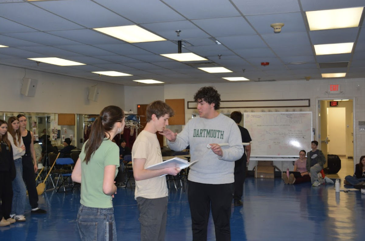 Kavan Walker (Jean Valjean), Harry Shapiro (Inspector Javert), and Vicky Vicky Colomé-Bonazza (Fantine) rehearse their lines.