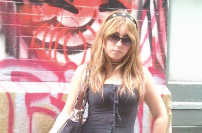 Alexi De La Cruz-Ramirez poses in front of graffiti in her stylish outfit