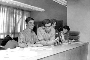 Mr. Nathanson (second from left) and his fellow Shoreline editor, Terry Fisher,  hard at work organizing the layout of the newspaper. 