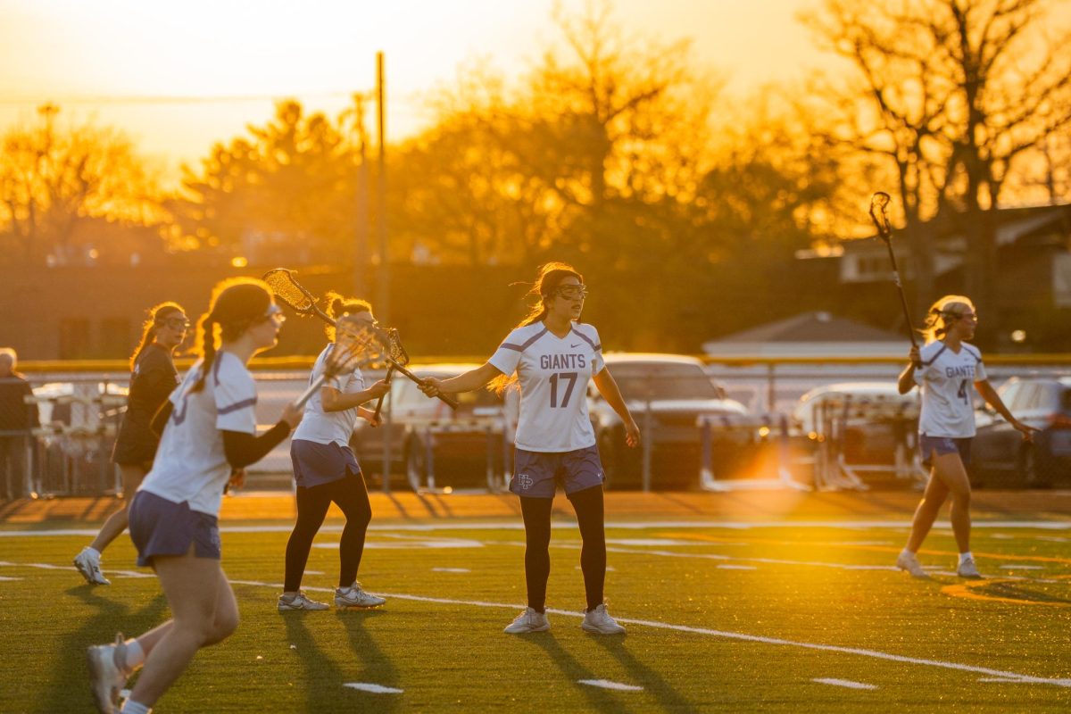 As the sun sets, Senior Jillian Wernick plays defense in the heat of the game.